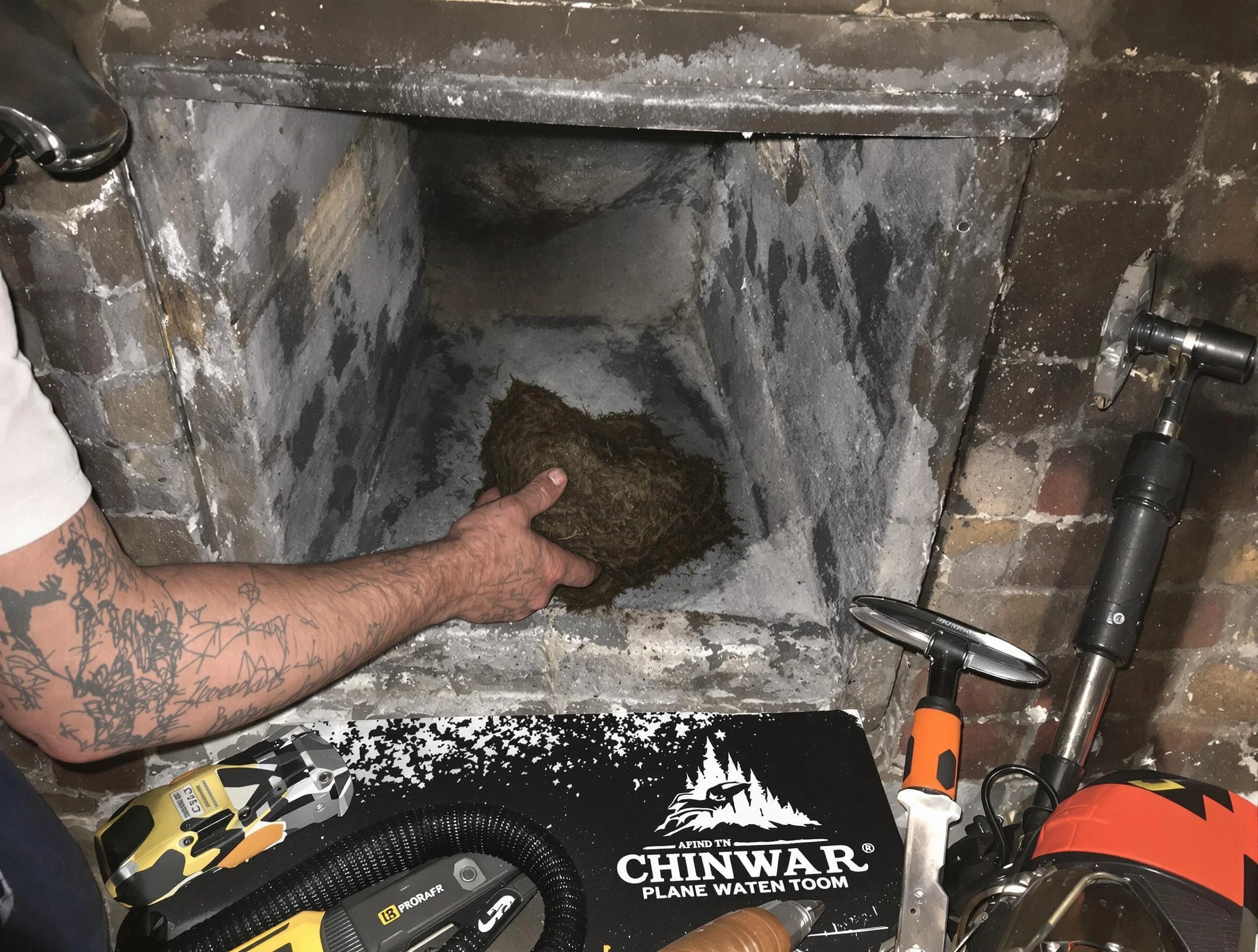 Belmont Chimney Sweep safely removing debris and screening chimney in Belmont, MA