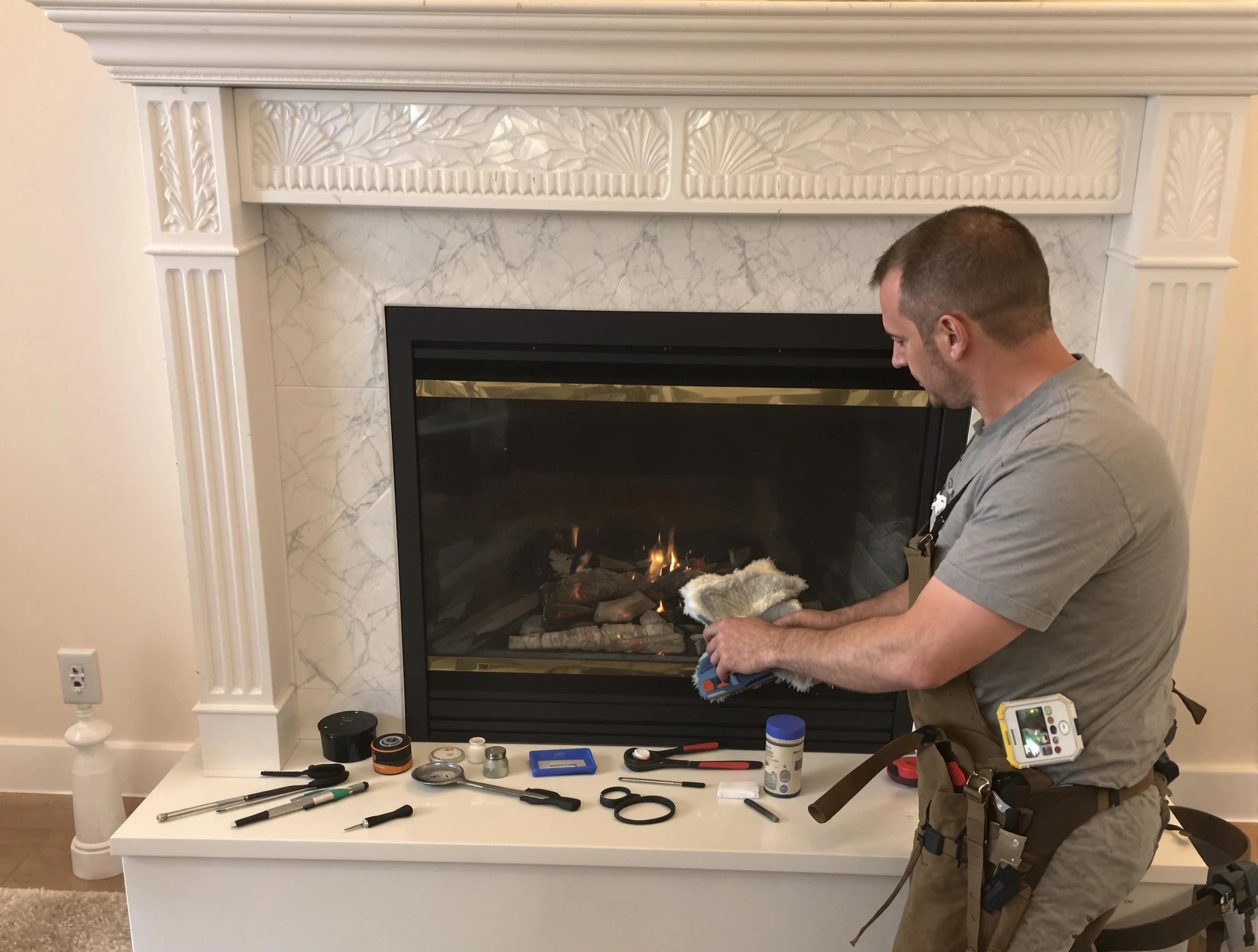 Belmont Chimney Sweep performing fireplace maintenance in Belmont, MA